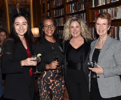 Four women enjoying cocktails