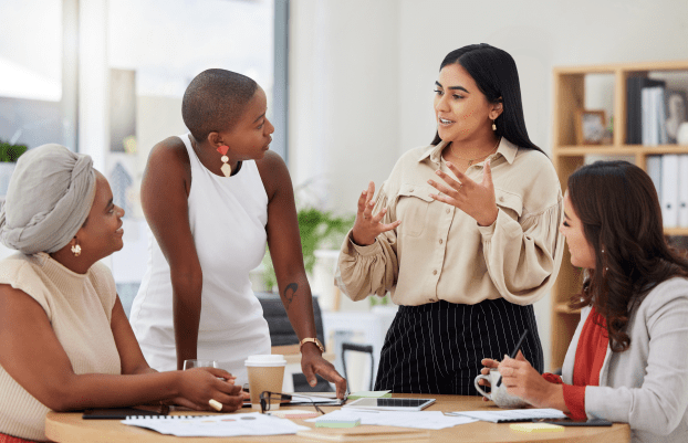 Diverse group, teamwork and young business women brainstorming, collaboration or cooperation. Ambitious confident professional team of colleagues talking and planning a marketing strategy together.