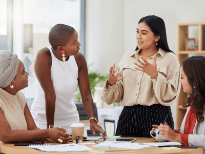 Diverse group, teamwork and young business women brainstorming, collaboration or cooperation. Ambitious confident professional team of colleagues talking and planning a marketing strategy together.
