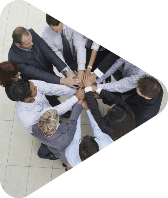 businesspeople arms outstretched with hands on top of each other