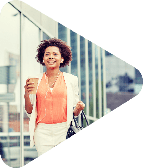 business and people concept - young smiling african american businesswoman with coffee cup in city