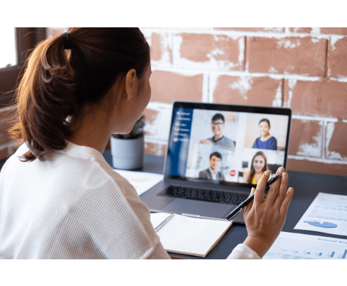 Young Asian businesswoman work at home and virtual video conference meeting with colleagues business people, online working, video call due to social distancing at home office