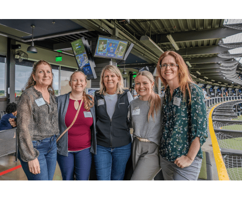 four women at top golf
