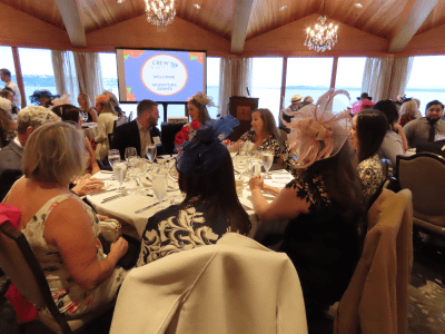 group-of-people-sitting-at-tables-for-an-event