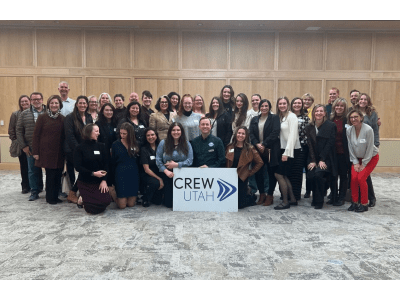 Group photo holding a CREW Utah sign