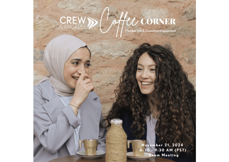 Two women having coffee and laughing