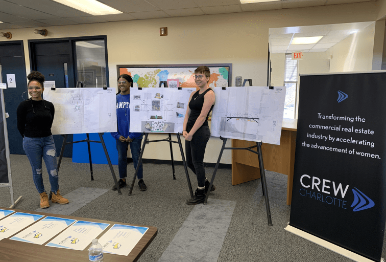 Three women Presenting from CREW Charlotte at a Career Outreach event