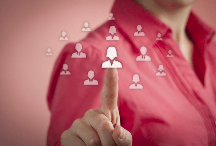 woman tapping touch screen icons of people