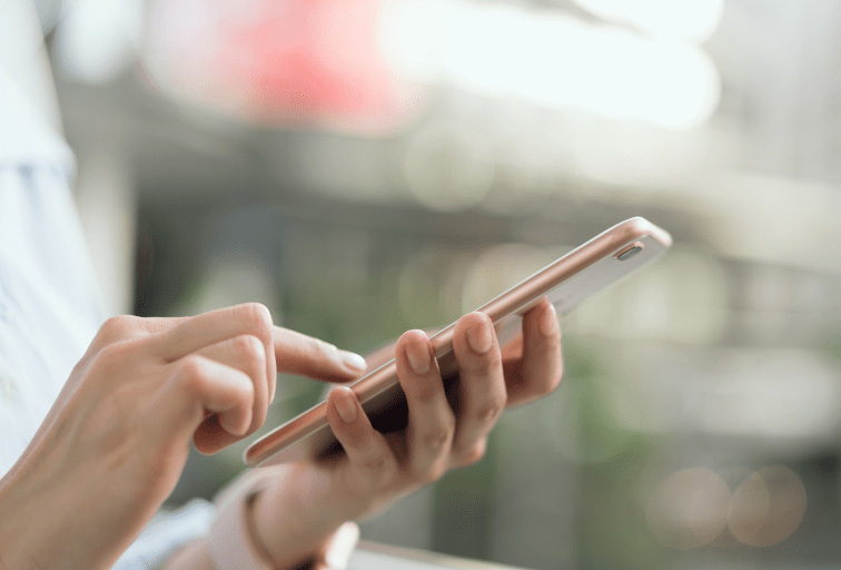 woman using smartphone on staircase in public areas, During leisure time. The concept of using the phone is essential in everyday life.