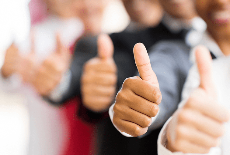 closeup portrait of business people giving thumbs up