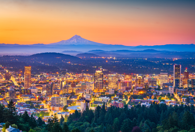 Portland, Oregon, USA skyline at dusk with Mt. Hood in the distance.