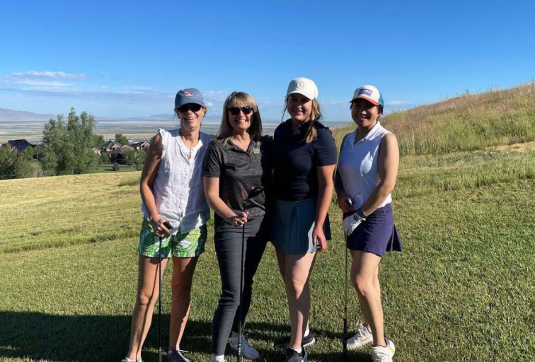 four ladies golfing