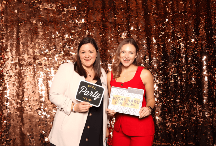 two women holding signs