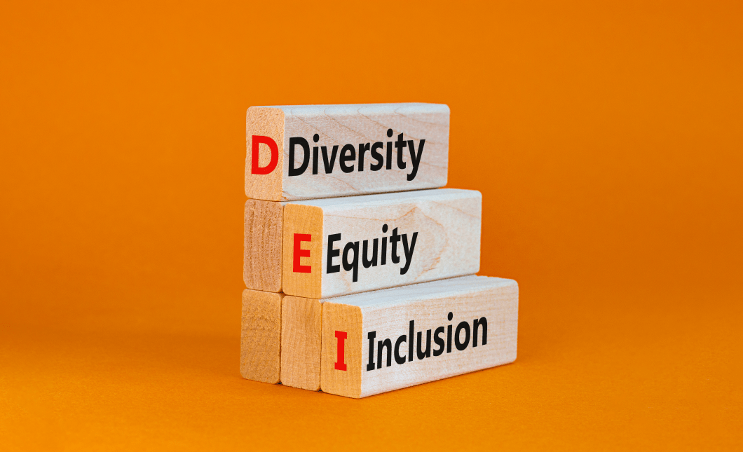 DEI, Diversity, equity, inclusion symbol. Wooden blocks with words DEI, diversity, equity, inclusion on beautiful orange background. Business, DEI, diversity, equity, inclusion concept.