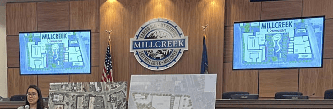 woman in a courtroom presenting on development in the area