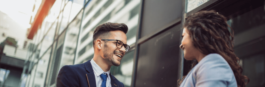 Handshake. Smiling business colleagues greeting each other outdoors