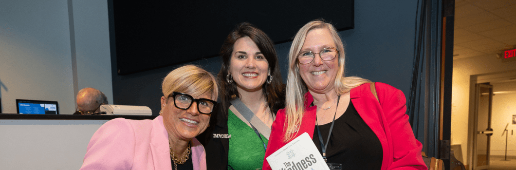 3 women with a copy of The Kindness Effect