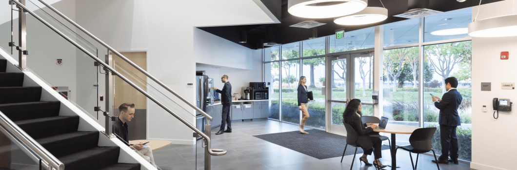 People sitting in the lobby of the Qualcomm Santa Clara campus