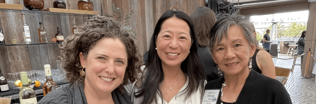 three women looking at camera