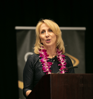 woman speaking at podium