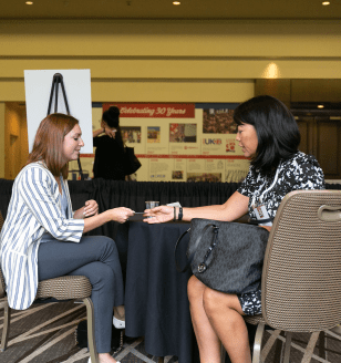 Women exchanging business cards