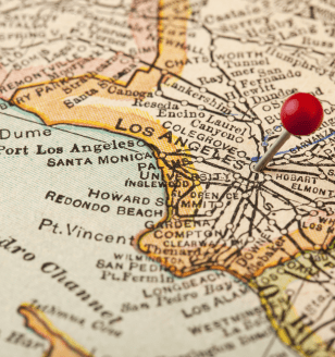 Los Angeles, California, vintage 1920s map (printed in 1926 - copyrights expired) with a red pushpin, selective focus