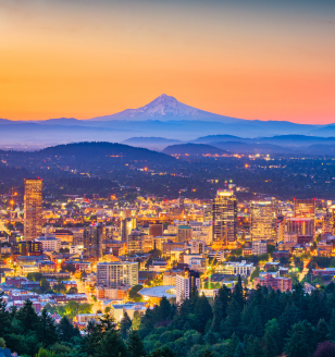 Portland, Oregon, USA skyline at dusk with Mt. Hood in the distance.