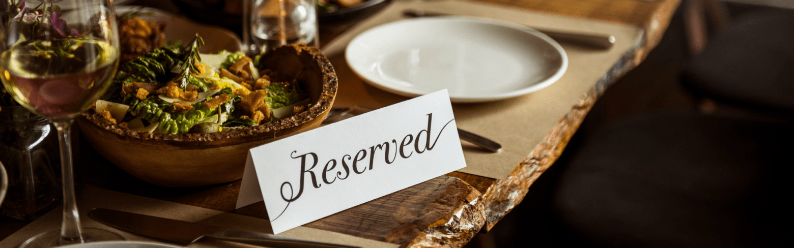 Fancy dinner table setting with reserved table tent.