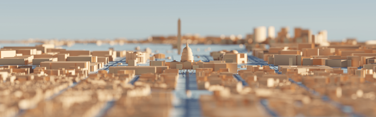 Wooden model of Washington DC with focus on capital building, monument in background.