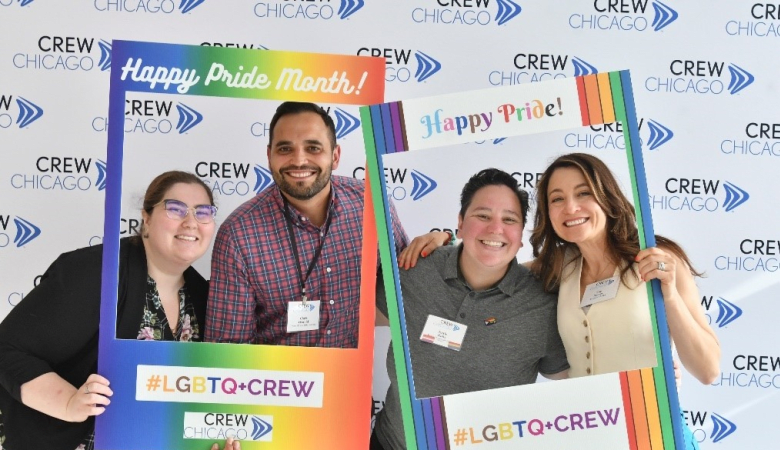 four people celebration LGBTQ Pride month with CREW Chicago