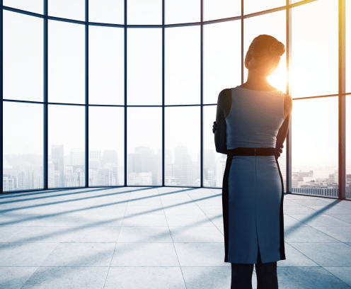 businesswoman thinking in office and looking to window