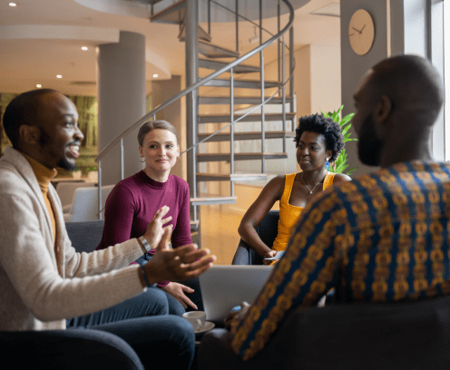 Group of diverse south african business people having a candid meeting in a modern work space