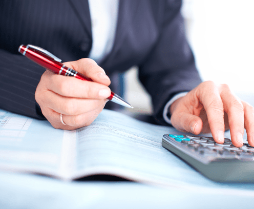 Hands of accountant business woman working with calculator.