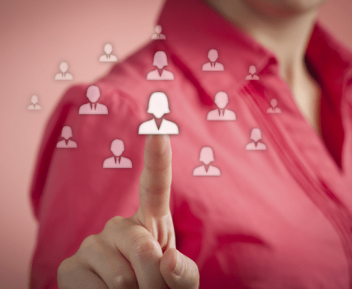 woman tapping touch screen icons of people