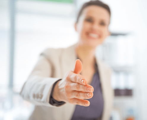 Closeup on happy business woman stretching hand for handshake