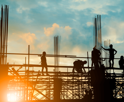 Silhouette of engineer and construction team working safely on scaffolding on high rise building. over blurred background sunset pastel for industry background with Light fair