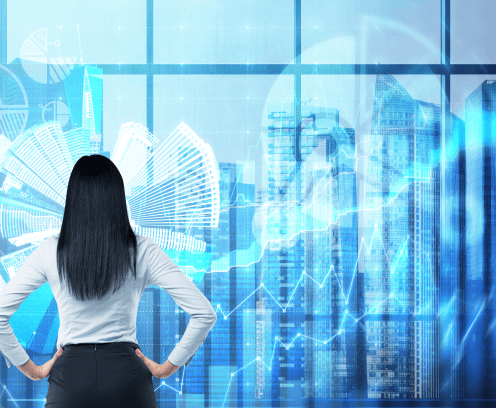 Rear view of the brunette woman who is looking out the window in the panoramic office in New York. Financial charts are over the whole panoramic windows.