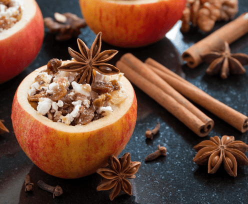 cored apple with cloves, raisins and cinnamon