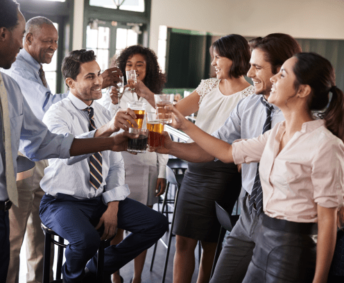 Business Colleagues Meeting For After Works Drinks In Bar Making A Toast