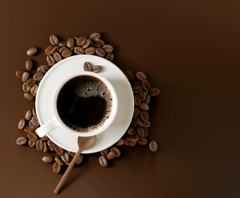 coffee-cup-beans-on-dark-brown-background