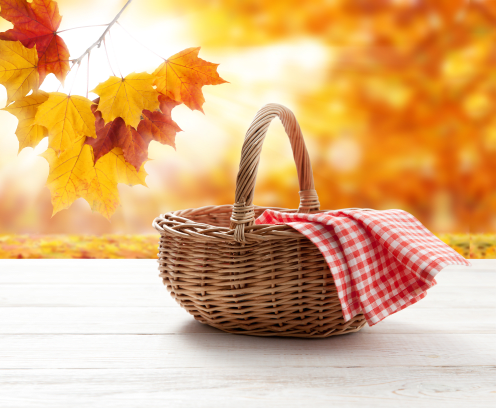 Empty basket with red napkin picnic on table place mockup. Autumn background,