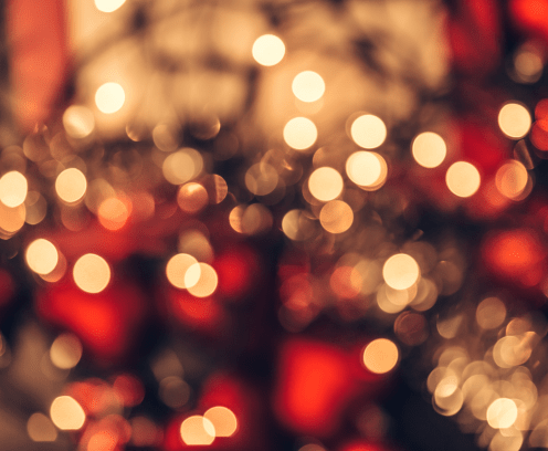 Abstract Christmas bokeh background. Red black and yellow colors