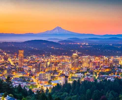 Portland, Oregon, USA skyline at dusk with Mt. Hood in the distance.