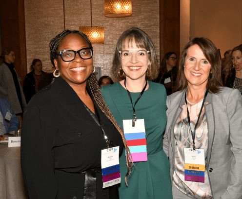 Three ladies at a cocktail event