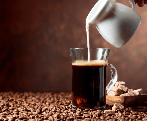 Coffee latte and brown sugar on a table with coffee beans. Copy space.