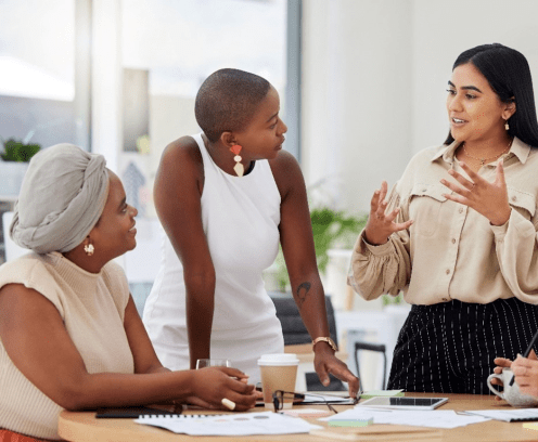 women-talking-around-table