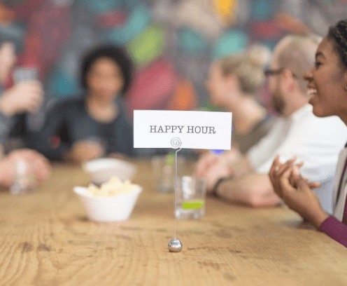 happy-hour-sign-on-table