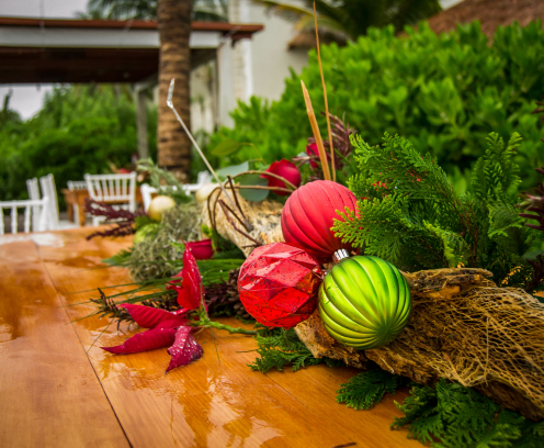 Christmas centerpiece with ornaments on a wooden table