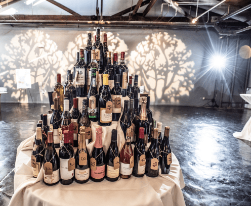 Tower of wine bottles.