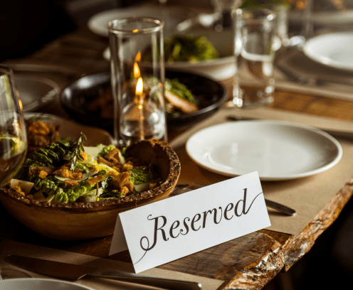 Fancy dinner table setting with reserved table tent.